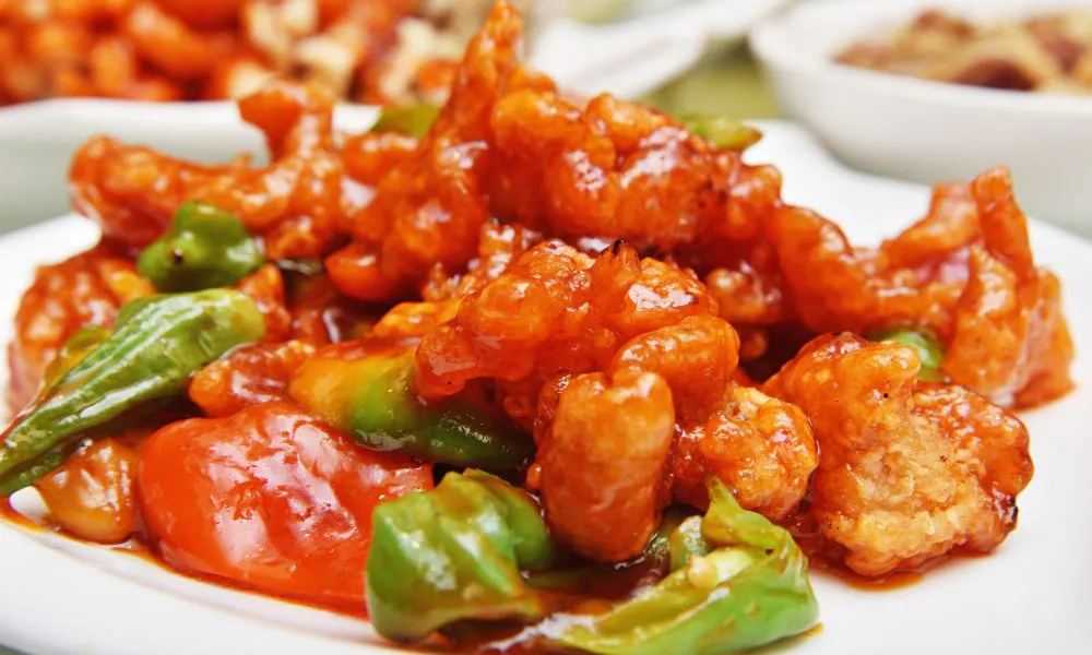 Sweet and sour pork with bell peppers in glossy sauce at Lucky Dumplings, a Dumpling Restaurant in Great Neck